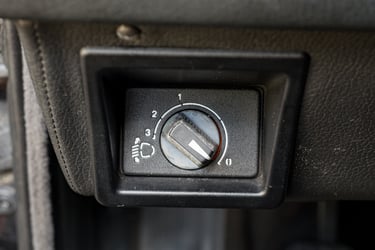 BMW E30 headlight aim control