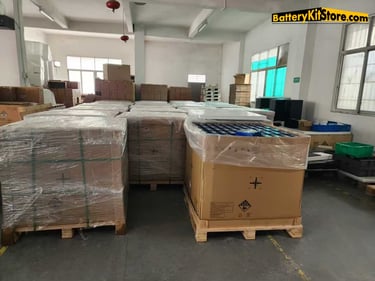 pallets of LiFePO4 prismatic battery cells in carton boxes