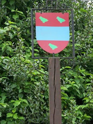 The old Thwing crest sign that stood at the crossroads. Now replaced. 