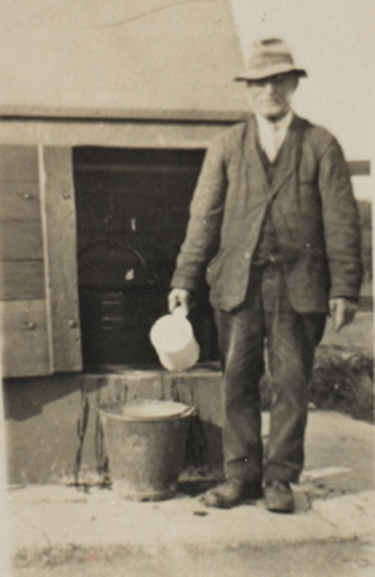 William Berriman at the well, Main Street, Thwing. (By the phone box.)