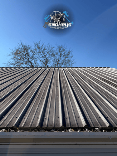 A metal roof before a soft wash cleaning