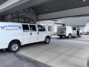 Steamaster Carpet Cleaning service vehicles in Mid-Michigan