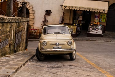 Vintage Fiat 500 parked on a cobble street 