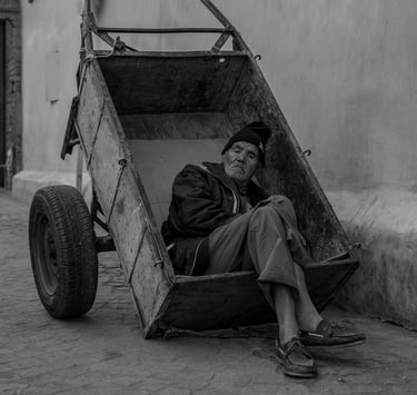 A man resting watching the world go by, reflecting on life
