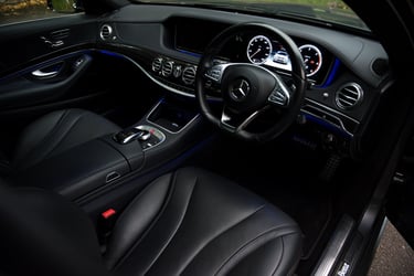 Mercedes car interior picture with front driver door open