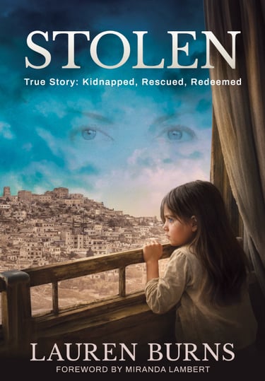 Book cover for Stolen by Lauren Burns, showing a young girl looking out a window at a Middle Eastern city.