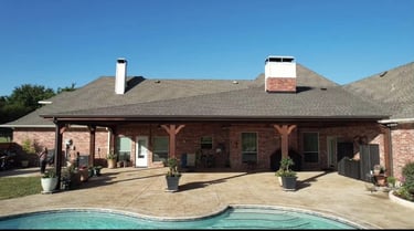 Bricked house extented covered patio.