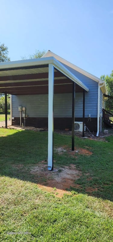 Metal Patio Next to Small Shed