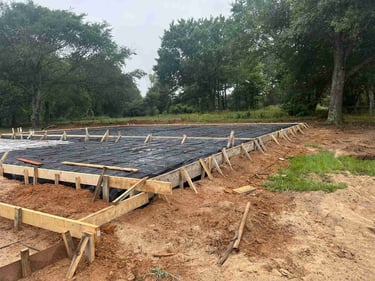 Large concrete foundation formwork with rebar.