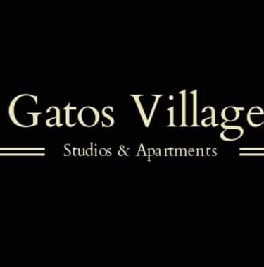 Gatos village studios luxurious suites and lofts logo