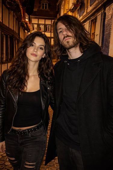 PreSexHeadache members Trash Swallow and Vera Solina in a warm nighttime street portrait