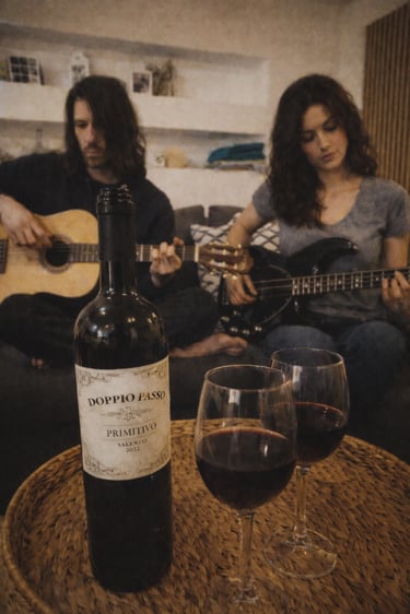Trash Swallow and Vera Solina of PreSexHeadache playing acoustic guitars in an intimate indoor scene