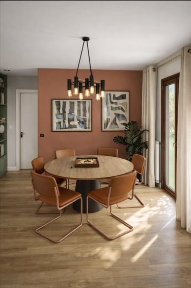 Modern dining room featuring a round oak table, terracotta leather chairs, and a black chandelier.