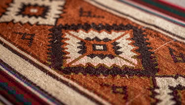 Artistic close-up of a hand weaving a colorful aguayo textile with patterns in burnt orange and soft cream, South American / Brazilian / Bolivian workshop.