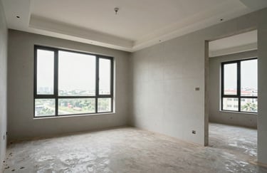 An interior shot of a newly constructed modern apartment in South Asia, featuring elegant tiling, clean walls, and large windows with natural light.