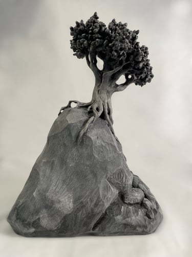 Graine 54, sculpture en marbre noir golzine par le sculpteur Herrel
