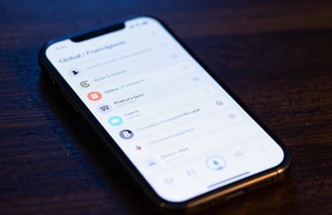 A close-up of a high-tech smart device displaying a clean dashboard interface, placed on a dark wooden surface with soft bokeh lighting in dark blue, Global / Francophone.