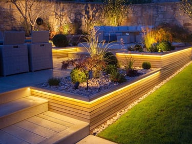 Modern backyard landscape design featuring tiered wooden planters with warm LED strip lighting and stone garden beds.