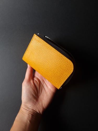 Yellow grained L-shape wallet with zipper closure