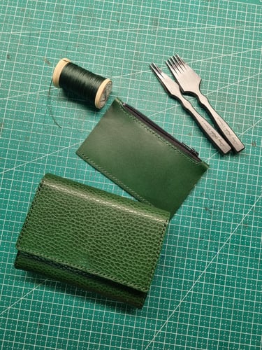 Green grained textured leather wallet with a flap closure