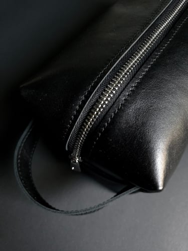 Black thin leather dopp kit