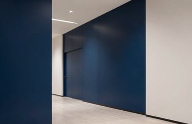 Minimal corporate vector icon of a shield with a lock, navy blue on a clean white background, flat