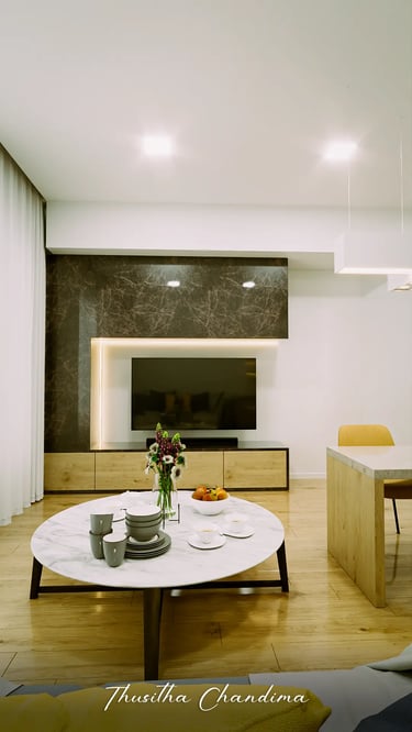 Contemporary apartment living room featuring a TV wall unit, warm lighting and wooden flooring, shown as a high quality 3D vi