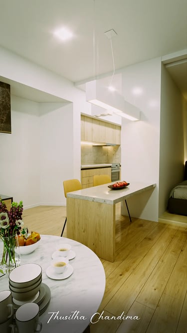 Modern apartment dining area with round table and cozy living corner, created as a photorealistic 3D interior render by Thusi