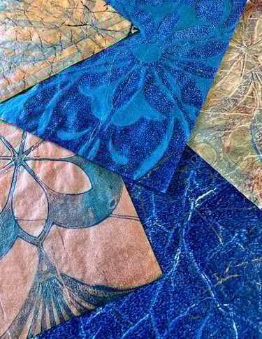 Blue collage papers with layered botanical stencil patterns