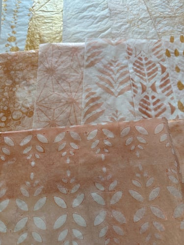 Neutral toned collage papers with subtle pattern details