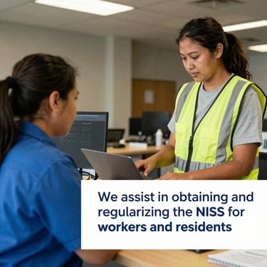 Close-up of hands typing on a laptop keyboard with accounting spreadsheets on the screen.