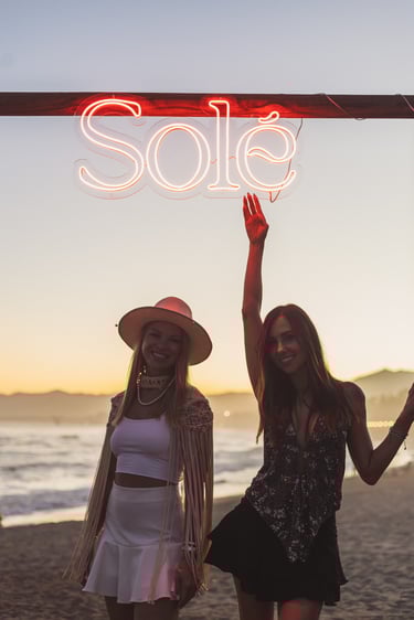 Exclusive entrance to SOLÉ at Trocadero Zanzibar featuring the signature tribal wooden doors and sun