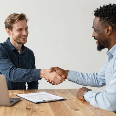 person in black long sleeve shirt holding babys hand