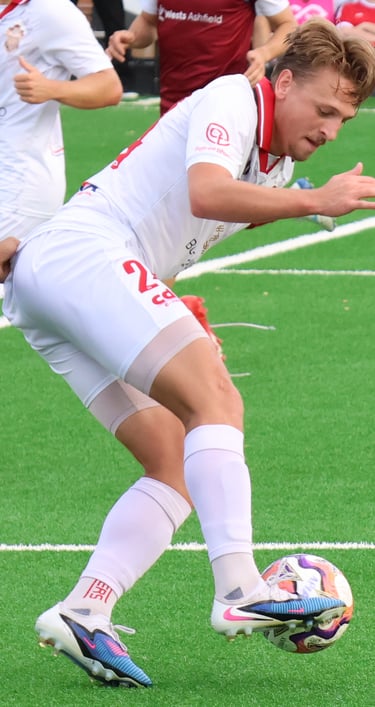 Captain Lachlen Scott shields the ball