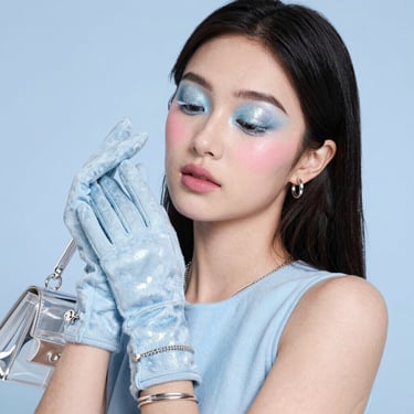 woman with blue hair looking at her left side