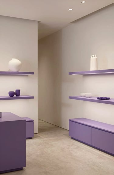 Minimalist interior of a Brazilian design boutique with clean lines and soft purple color accents.