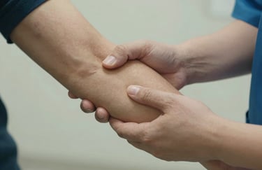 Detail of a medical assistant's hand gently supporting a patient's arm during a transition, conveying empathy and professional care.