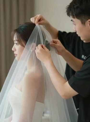 A behind-the-scenes shot of our Image Consultant adjusting a bride's veil, reflecting the VIP service experience.