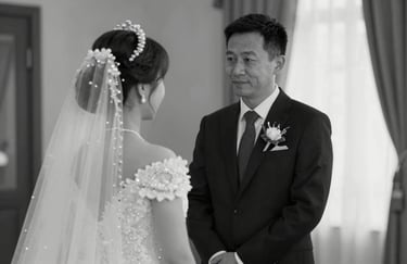 Emotional documentary shot in black and white of a father seeing his daughter in her wedding dress for the first time.