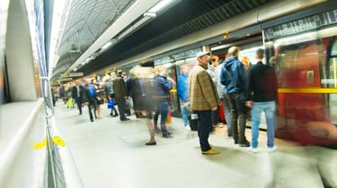 crowd of people by a train illustrating the observe method