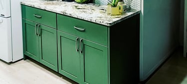 Custom kitchen cabinetry in a unique green finish, a project created for a Pearce Woodworks client.
