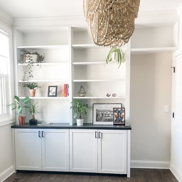 Custom built in wall unit with shelving and cabinetry for a Pearce Woodworks Detroit client.