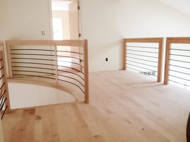 Custom modern staircase and banisters handmade from oak.