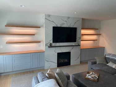Custom built in wall unit with backlit shelving and cabinetry for a Pearce Woodworks Detroit client.