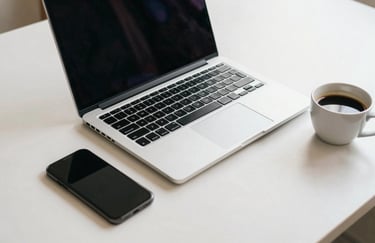 An organized desk set with a modern laptop, a smartphone, and a cup of coffee. The composition is clean and focused, using off-white and muted blue tones, reflecting a productive South American / Brazilian workday.
