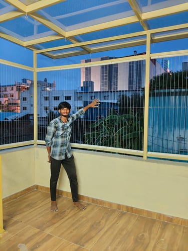 A team of professional workers in safety gear installing a complex net system on a high-rise. Profes