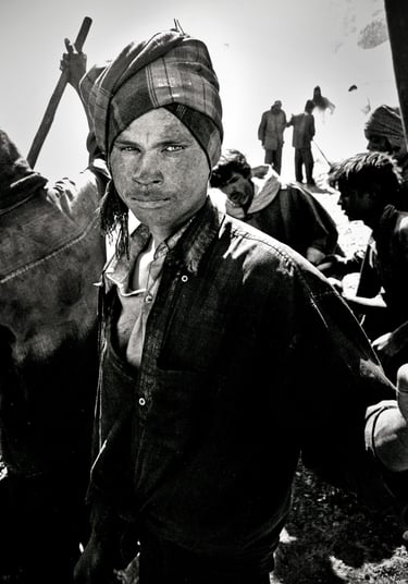 Building roads at the top of the world, a roadbuilder poses for an image in the Himalaya of Ladakh.