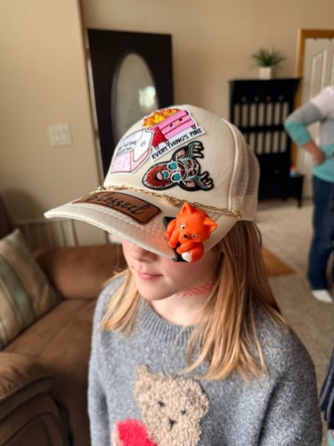 girl in finished hat with fox brimpet