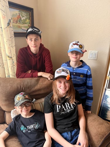 kids wearing finished hats