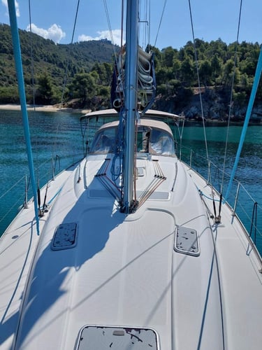 Sail Boat Christina anchored in a crystal-clear bay during a private sailing cruise in Halkidiki
